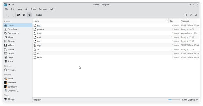 A screenshot of Dolphin, KDE's
file manager, showing the user's home directory with the places panel on the
left side containing various categorized entries. The entries below the Devices
category read flood, demeter, coleridge, and OnePlus 12, each with its own
pretty name and relevant icon.